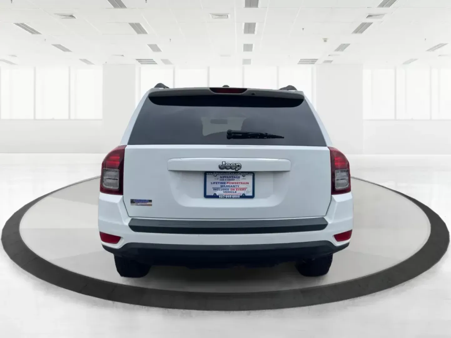 2014 Bright White Clearcoat Jeep Compass Sport FWD (1C4NJCBA9ED) with an 2.0L L4 DOHC 16V engine, located at 880 E. National Road, Vandalia, OH, 45377, (937) 908-9800, 39.891918, -84.183594 - 2014 Jeep Compass Sport FWD - Photo#3