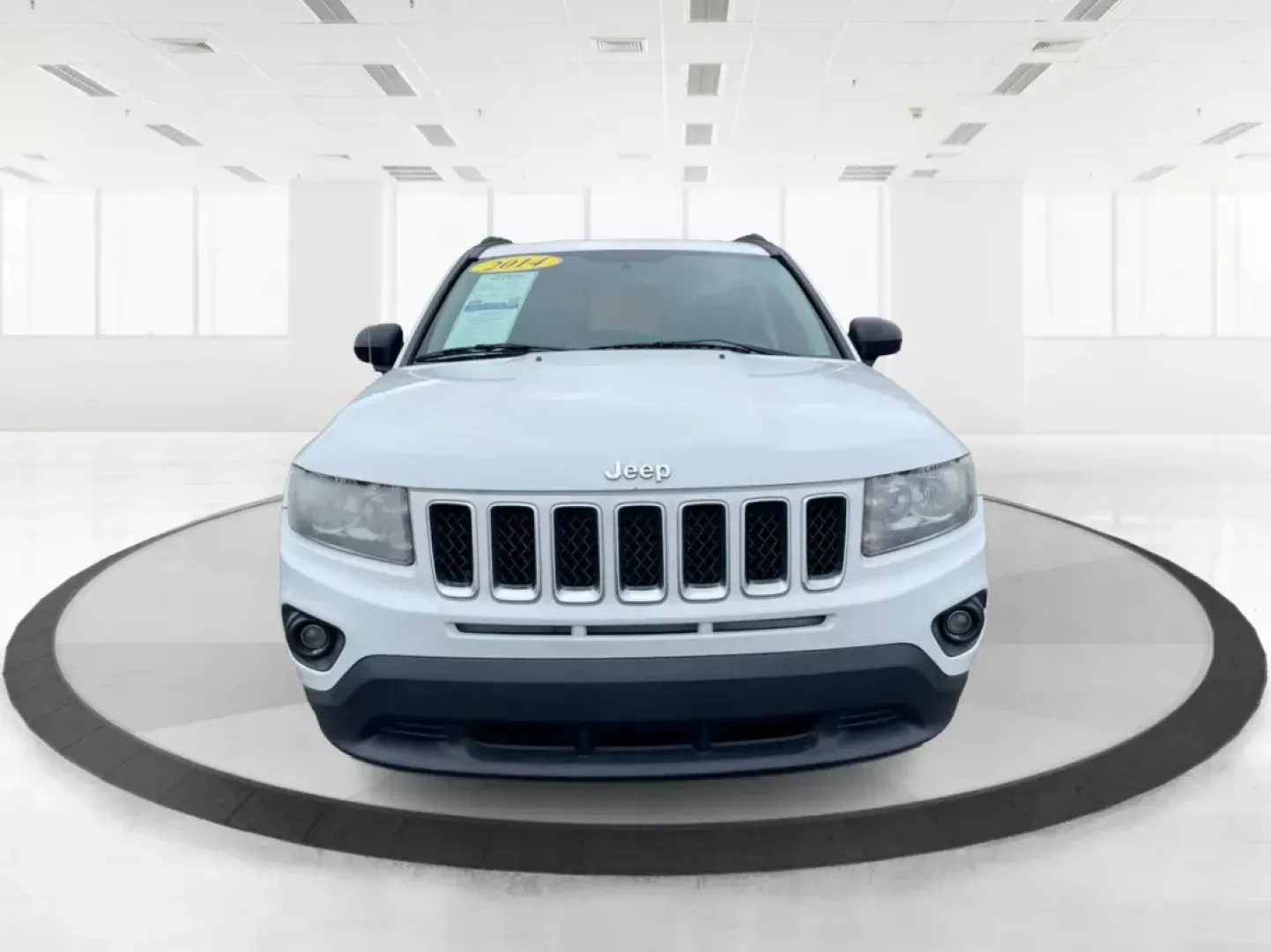 2014 Bright White Clearcoat Jeep Compass Sport FWD (1C4NJCBA9ED) with an 2.0L L4 DOHC 16V engine, located at 880 E. National Road, Vandalia, OH, 45377, (937) 908-9800, 39.891918, -84.183594 - 2014 Jeep Compass Sport FWD - Photo#6
