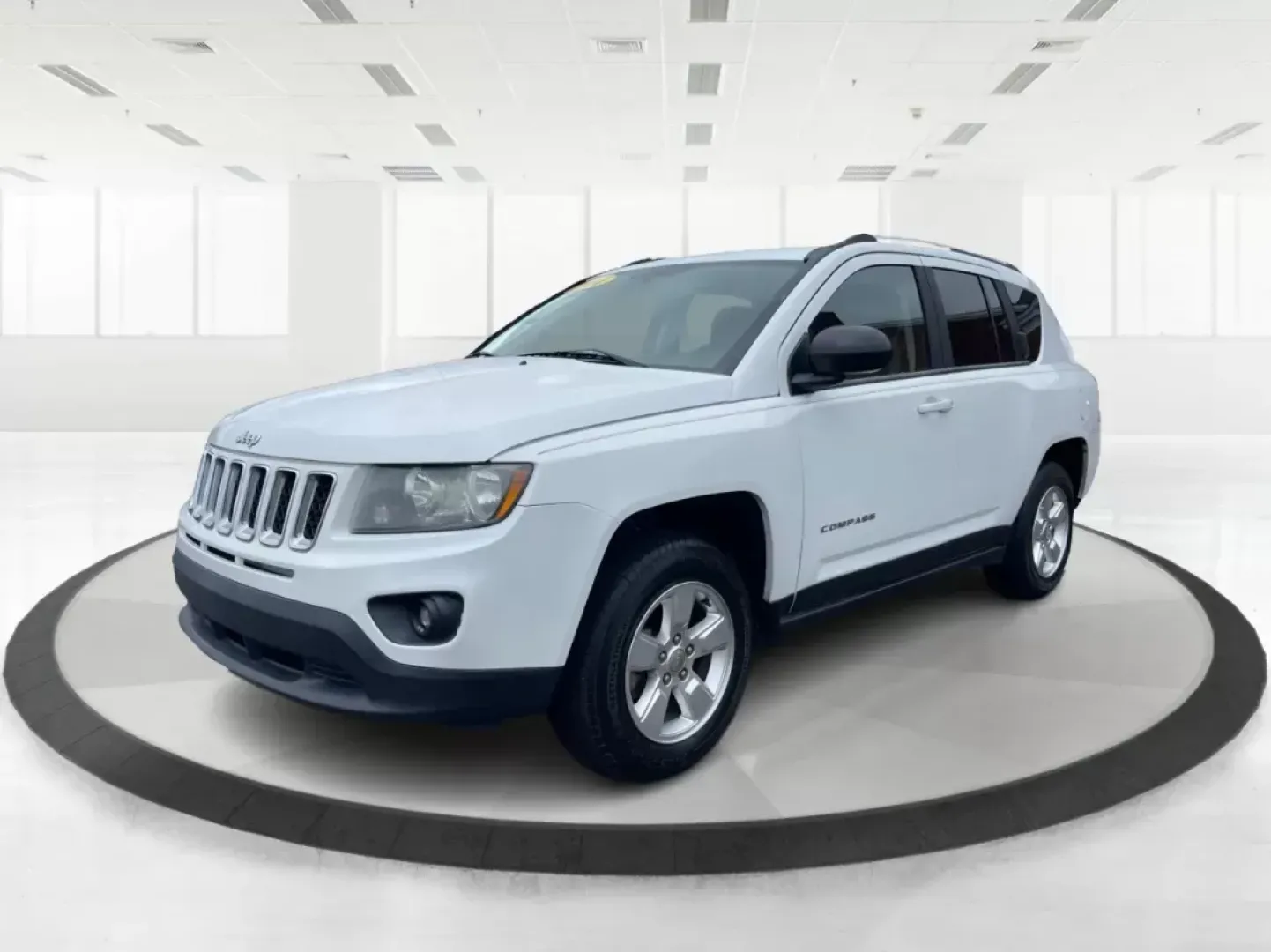 2014 Bright White Clearcoat Jeep Compass Sport FWD (1C4NJCBA9ED) with an 2.0L L4 DOHC 16V engine, located at 880 E. National Road, Vandalia, OH, 45377, (937) 908-9800, 39.891918, -84.183594 - 2014 Jeep Compass Sport FWD - Photo#7