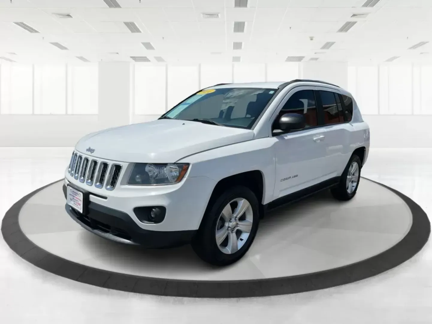 2014 Jeep Compass Sport (1C4NJDBB6ED) with an 2.4L I-4 DOHC engine, located at 401 Woodman Dr, Riverside, OH, 45431, (937) 908-9800, 39.760899, -84.123421 - **Discover Your Next Adventure with the 2014 Jeep Compass Sport at Advantage Car and Credit!**<br /> <br /> Are you ready to elevate your driving experience? Whether you're a weekend adventurer, a busy commuter, or a growing family seeking reliability, the 2014 Jeep Compass Sport is the perfect comp - Photo#7