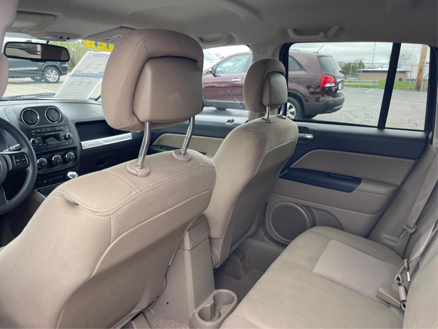 2014 Bright White Clearcoat Jeep Compass Sport FWD (1C4NJCBA9ED) with an 2.0L L4 DOHC 16V engine, located at 8750 N County Rd 25A, Piqua, OH, 45356, (937) 908-9800, 40.164391, -84.232513 - 2014 Jeep Compass Sport FWD - Photo#9