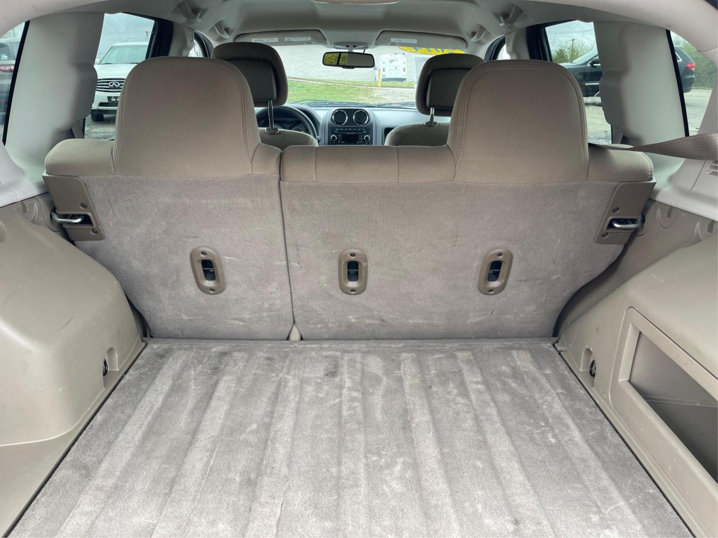 2014 Bright White Clearcoat Jeep Compass Sport FWD (1C4NJCBA9ED) with an 2.0L L4 DOHC 16V engine, located at 8750 N County Rd 25A, Piqua, OH, 45356, (937) 908-9800, 40.164391, -84.232513 - 2014 Jeep Compass Sport FWD - Photo#10