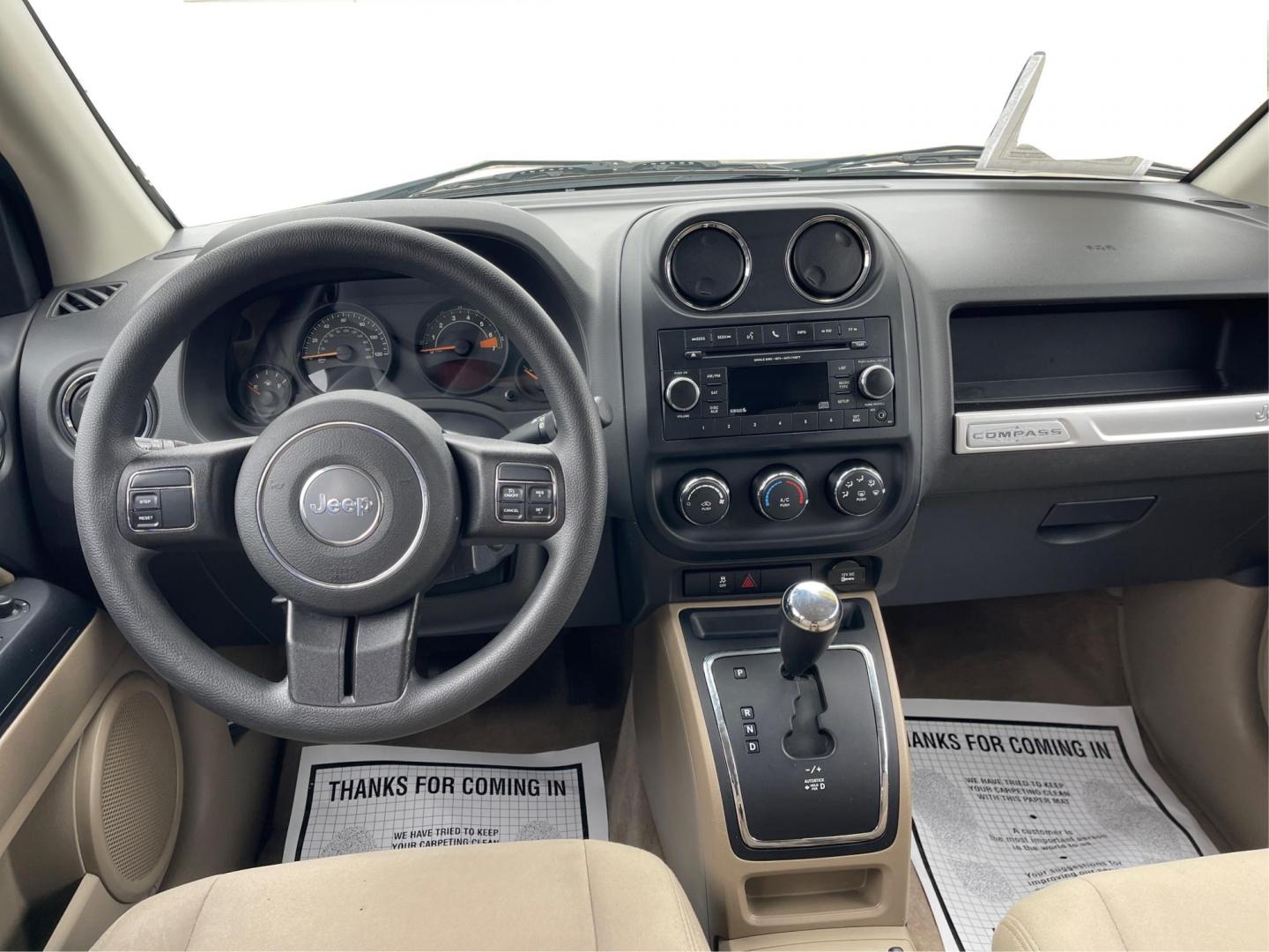 2014 Bright White Clearcoat Jeep Compass Sport FWD (1C4NJCBA9ED) with an 2.0L L4 DOHC 16V engine, located at 8750 N County Rd 25A, Piqua, OH, 45356, (937) 908-9800, 40.164391, -84.232513 - 2014 Jeep Compass Sport FWD - Photo#18