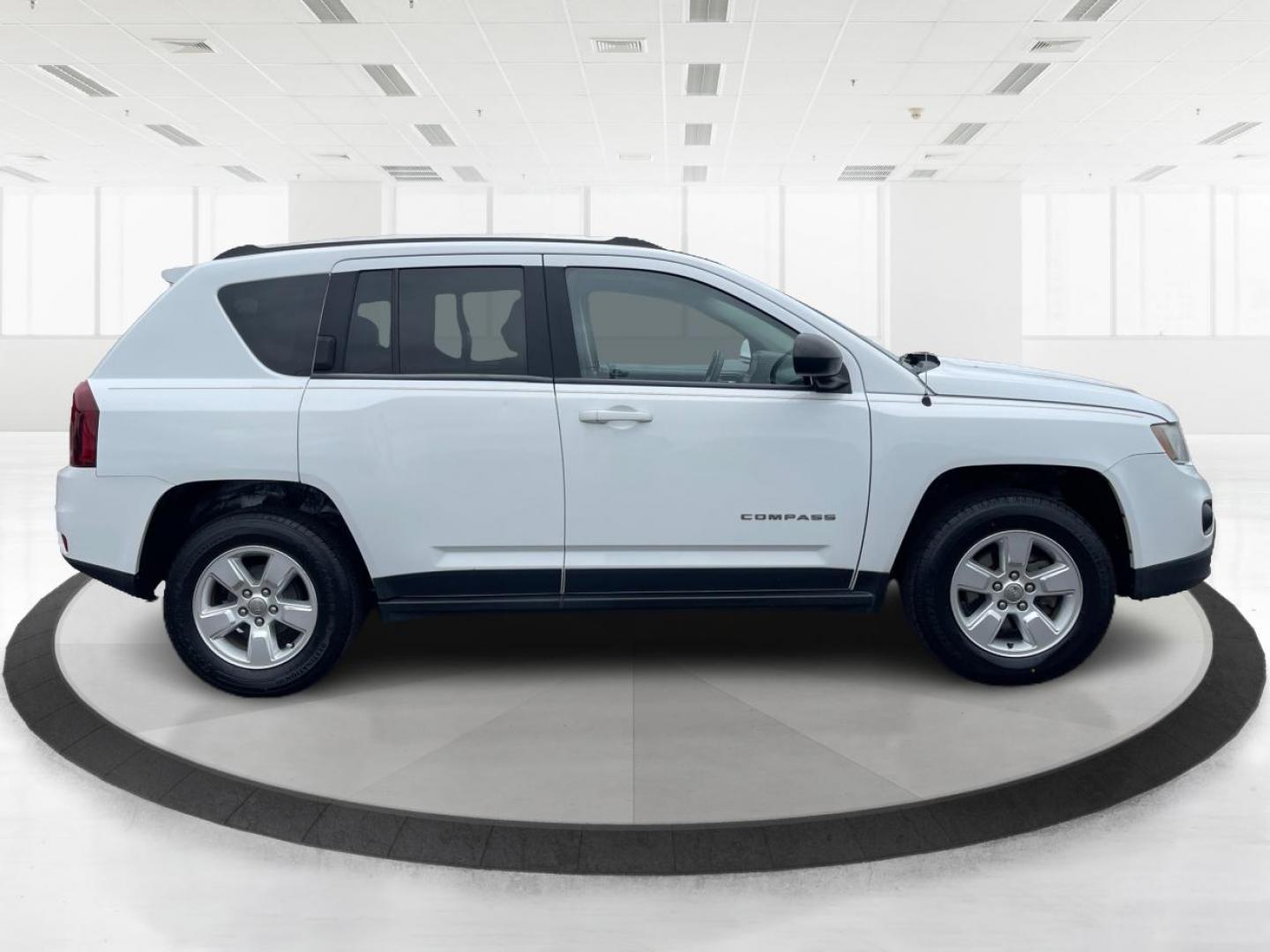 2014 Bright White Clearcoat Jeep Compass Sport FWD (1C4NJCBA9ED) with an 2.0L L4 DOHC 16V engine, located at 8750 N County Rd 25A, Piqua, OH, 45356, (937) 908-9800, 40.164391, -84.232513 - 2014 Jeep Compass Sport FWD - Photo#1