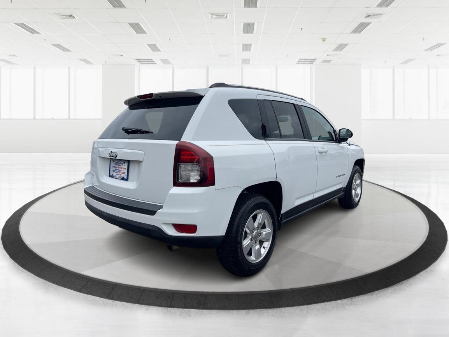 2014 Bright White Clearcoat Jeep Compass Sport FWD (1C4NJCBA9ED) with an 2.0L L4 DOHC 16V engine, located at 8750 N County Rd 25A, Piqua, OH, 45356, (937) 908-9800, 40.164391, -84.232513 - 2014 Jeep Compass Sport FWD - Photo#2