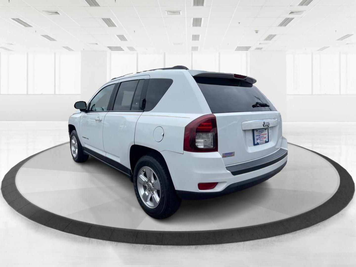 2014 Bright White Clearcoat Jeep Compass Sport FWD (1C4NJCBA9ED) with an 2.0L L4 DOHC 16V engine, located at 8750 N County Rd 25A, Piqua, OH, 45356, (937) 908-9800, 40.164391, -84.232513 - 2014 Jeep Compass Sport FWD - Photo#4