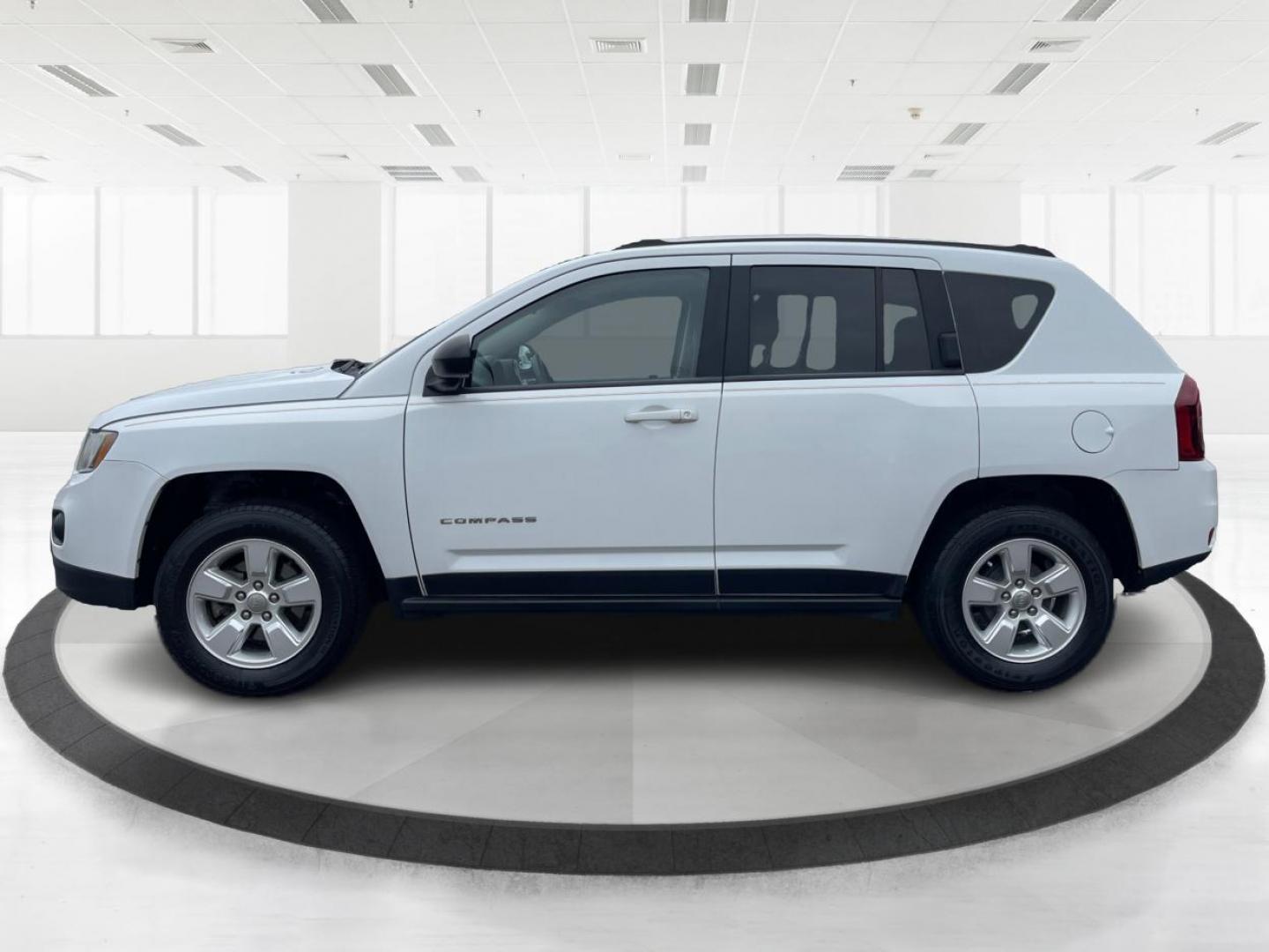 2014 Bright White Clearcoat Jeep Compass Sport FWD (1C4NJCBA9ED) with an 2.0L L4 DOHC 16V engine, located at 8750 N County Rd 25A, Piqua, OH, 45356, (937) 908-9800, 40.164391, -84.232513 - 2014 Jeep Compass Sport FWD - Photo#5