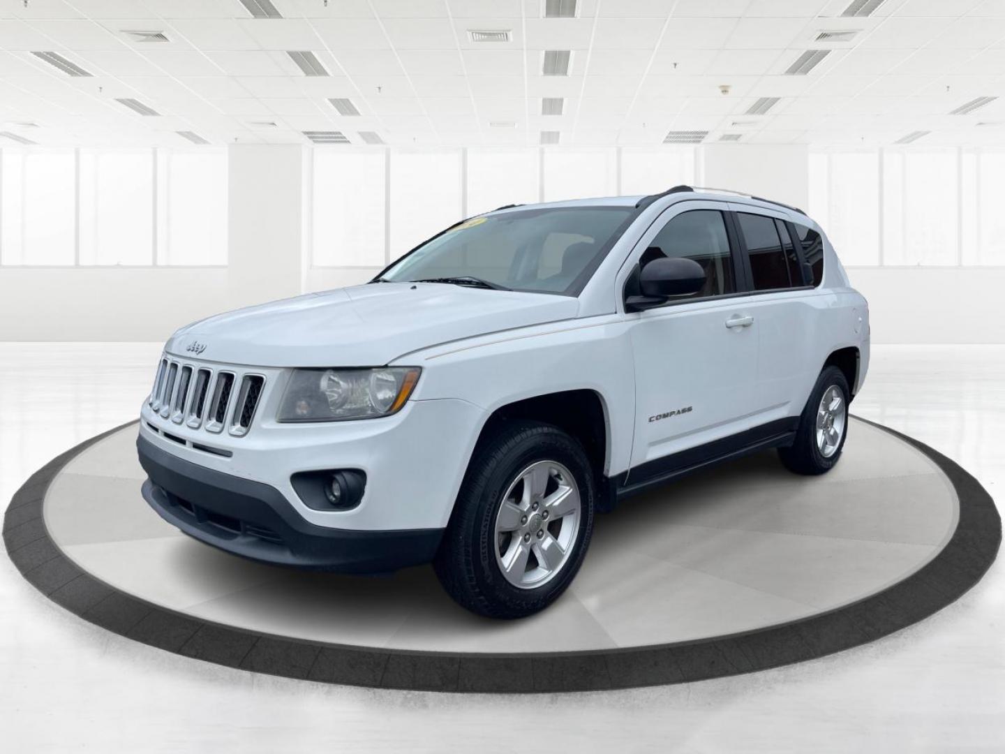 2014 Bright White Clearcoat Jeep Compass Sport FWD (1C4NJCBA9ED) with an 2.0L L4 DOHC 16V engine, located at 8750 N County Rd 25A, Piqua, OH, 45356, (937) 908-9800, 40.164391, -84.232513 - 2014 Jeep Compass Sport FWD - Photo#7