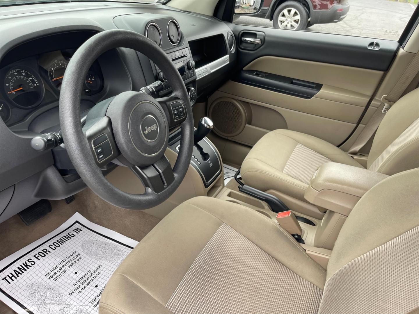 2014 Bright White Clearcoat Jeep Compass Sport FWD (1C4NJCBA9ED) with an 2.0L L4 DOHC 16V engine, located at 8750 N County Rd 25A, Piqua, OH, 45356, (937) 908-9800, 40.164391, -84.232513 - 2014 Jeep Compass Sport FWD - Photo#8