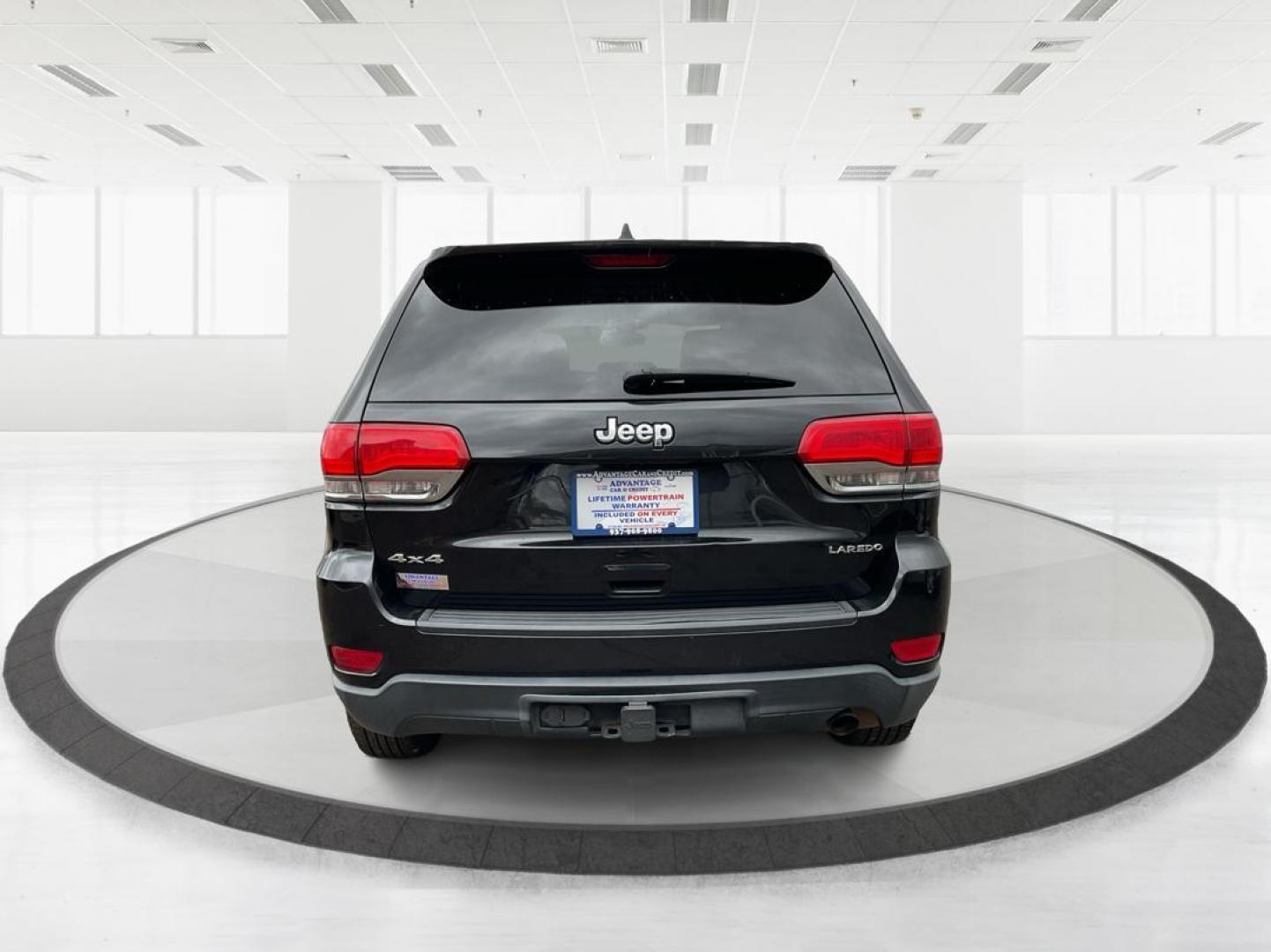 2014 Brilliant Black Crystal P Jeep Grand Cherokee Laredo 4WD (1C4RJFAG5EC) with an 3.6L V6 DOHC 24V engine, 5-Speed Automatic transmission, located at 401 Woodman Dr, Riverside, OH, 45431, (937) 908-9800, 39.760899, -84.123421 - 2014 Jeep Grand Cherokee Laredo 4WD - Photo#2