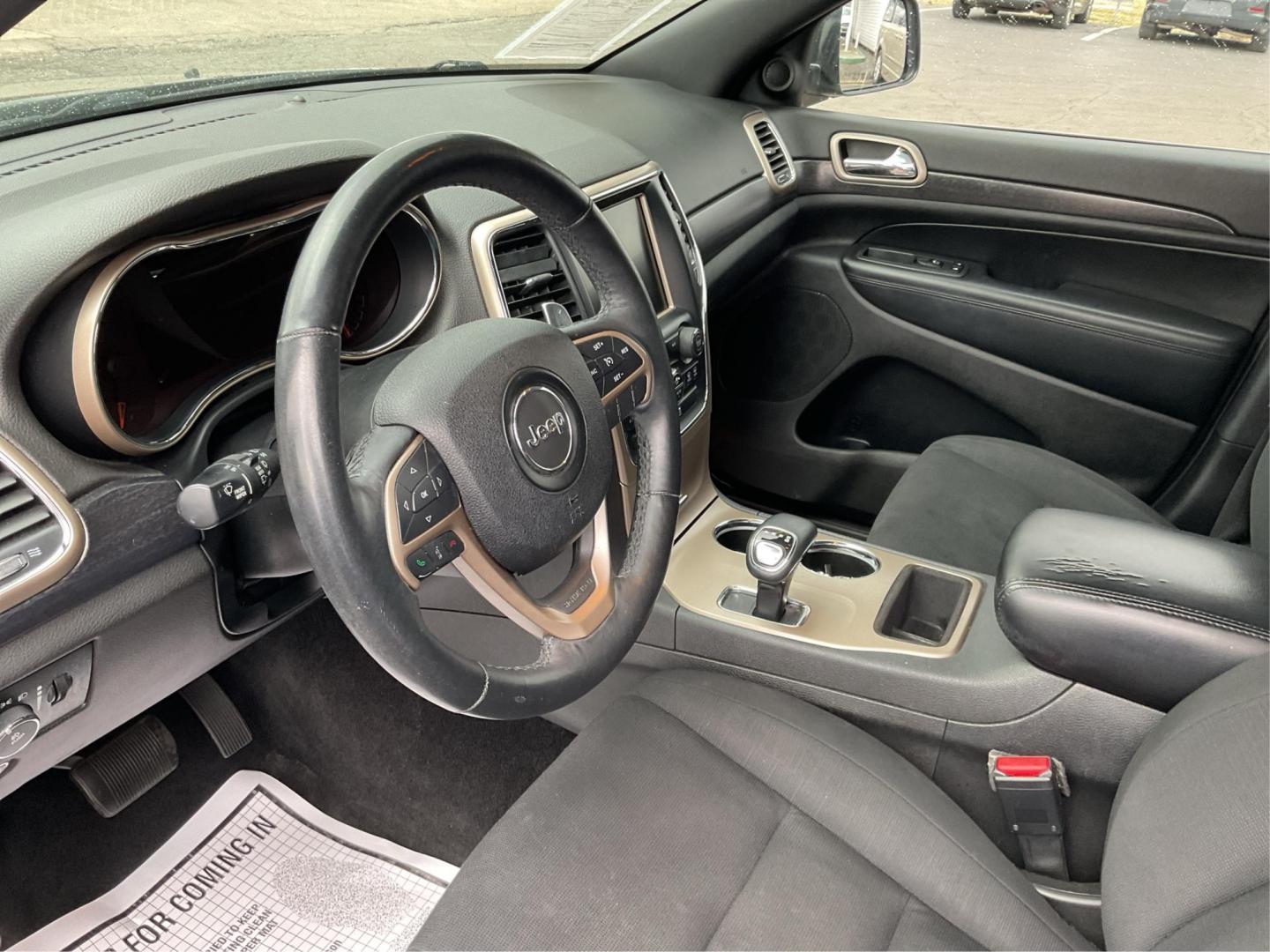 2014 Brilliant Black Crystal P Jeep Grand Cherokee Laredo 4WD (1C4RJFAG5EC) with an 3.6L V6 DOHC 24V engine, 5-Speed Automatic transmission, located at 401 Woodman Dr, Riverside, OH, 45431, (937) 908-9800, 39.760899, -84.123421 - 2014 Jeep Grand Cherokee Laredo 4WD - Photo#7