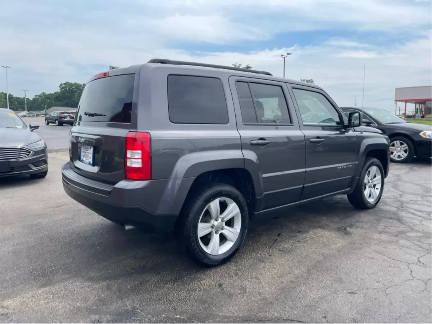 2014 Jeep Patriot Latitude 4WD (1C4NJRFB5ED) with an 2.4L L4 DOHC 16V engine, located at 1230 East Main St, Xenia, OH, 45385, (937) 908-9800, 39.688026, -83.910172 - **Adventure Awaits with the 2014 Jeep Patriot Latitude 4WD!**<br /> <br /> If you're longing for a vehicle that blends rugged capability with everyday comfort, look no further than the 2014 Jeep Patriot Latitude 4WD. Perfect for weekend adventures or daily commutes, this SUV is designed to take you - Photo#2