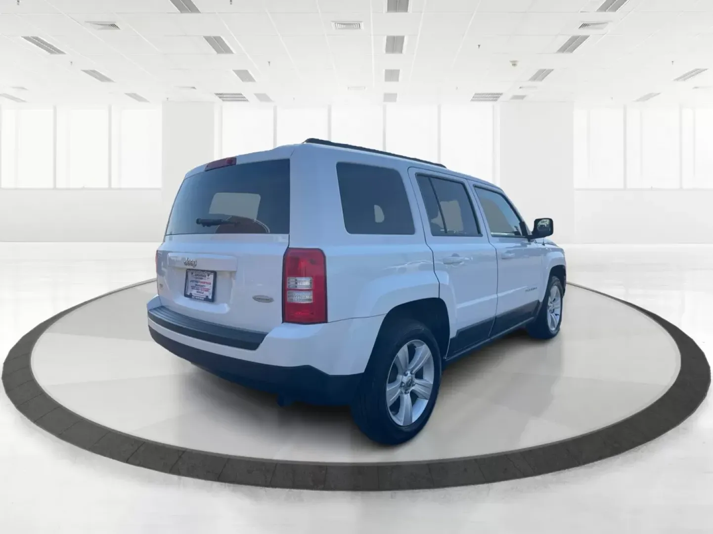 2014 Jeep Patriot Latitude (1C4NJPFB0ED) with an 2.4L I-4 DOHC engine, located at 1951 S Dayton Lakeview Rd., New Carlisle, OH, 45344, (937) 908-9800, 39.890999, -84.050255 - **Adventure Awaits with This 2014 Jeep Patriot Latitude! Perfect for Road Trips and Family Outings!**<br /> <br /> Explore the open road with confidence and comfort in this 2014 Jeep Patriot Latitude, now available at Advantage Car and Credit in Fairborn, OH. This SUV is the ideal companion for grow - Photo#2