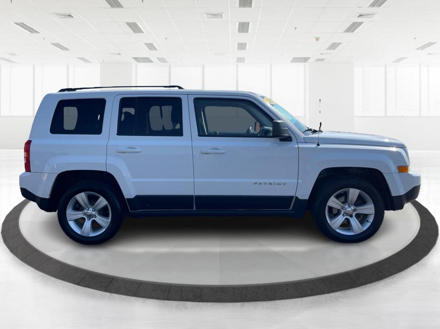 2014 Jeep Patriot Latitude (1C4NJPFB0ED) with an 2.4L I-4 DOHC engine, located at 1099 N County Rd 25A, Troy, OH, 45373, (937) 908-9800, 40.057079, -84.212883 - 2014 Jeep Patriot Latitude - Photo#1