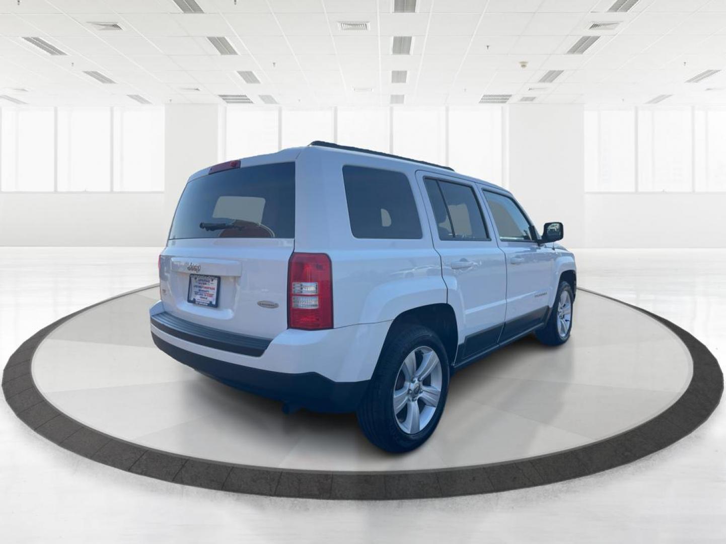 2014 Jeep Patriot Latitude (1C4NJPFB0ED) with an 2.4L I-4 DOHC engine, located at 1099 N County Rd 25A, Troy, OH, 45373, (937) 908-9800, 40.057079, -84.212883 - 2014 Jeep Patriot Latitude - Photo#2