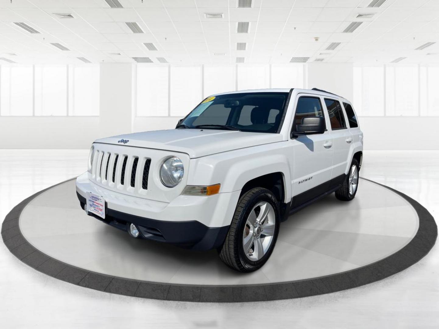 2014 Jeep Patriot Latitude (1C4NJPFB0ED) with an 2.4L I-4 DOHC engine, located at 1099 N County Rd 25A, Troy, OH, 45373, (937) 908-9800, 40.057079, -84.212883 - 2014 Jeep Patriot Latitude - Photo#7
