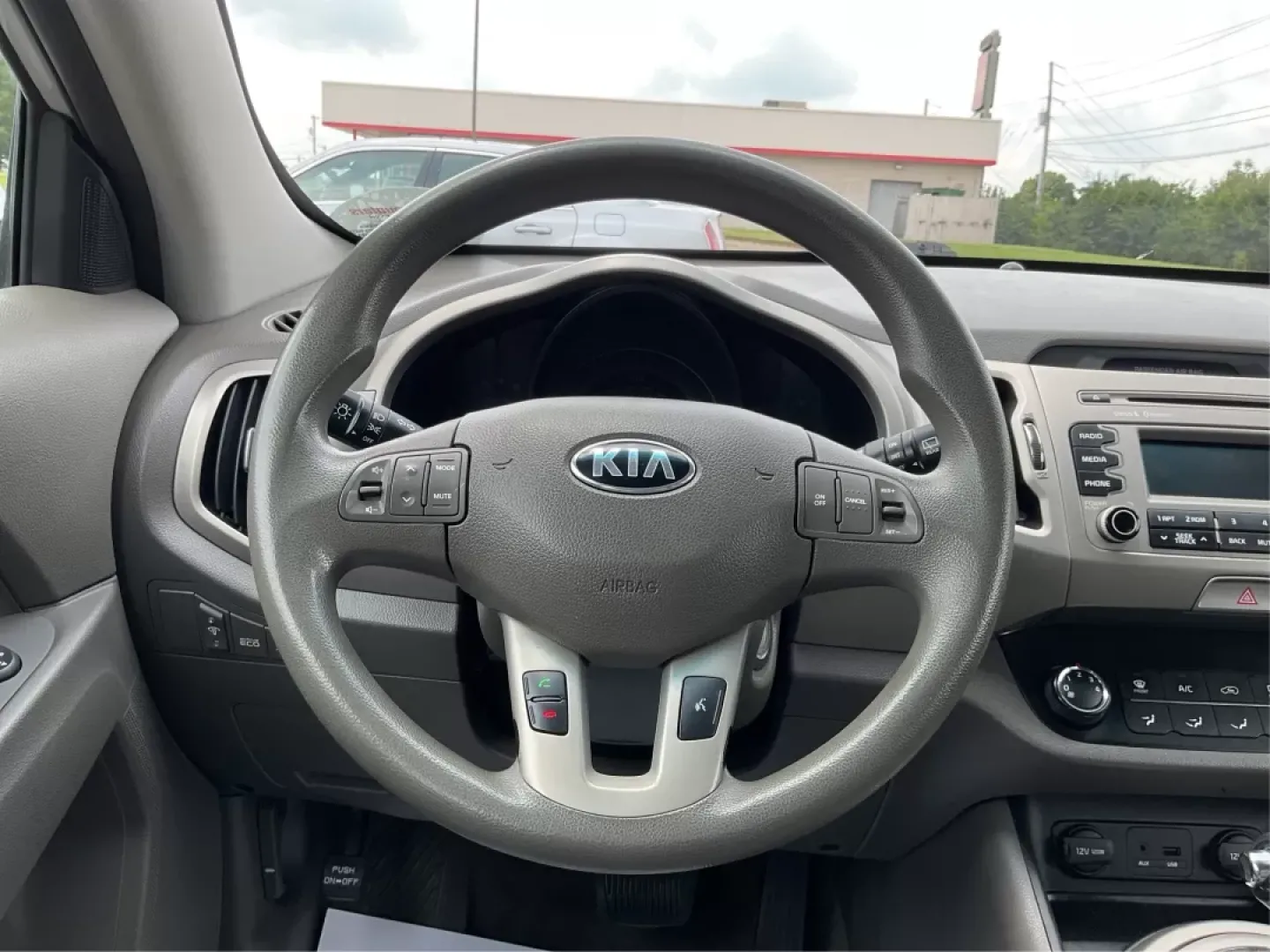 2014 Kia Sportage LX (KNDPBCAC6E7) with an Other engine, located at 8750 N County Rd 25A, Piqua, OH, 45356, (937) 908-9800, 40.164391, -84.232513 - **Adventure Awaits: 2014 Kia Sportage LX Ready for Your Next Journey!**<br /> <br /> Are you in search of a reliable vehicle that combines style, comfort, and versatility? Look no further than this 2014 Kia Sportage LX, perfect for weekend getaways, family road trips, or daily commutes. This crossov - Photo#15