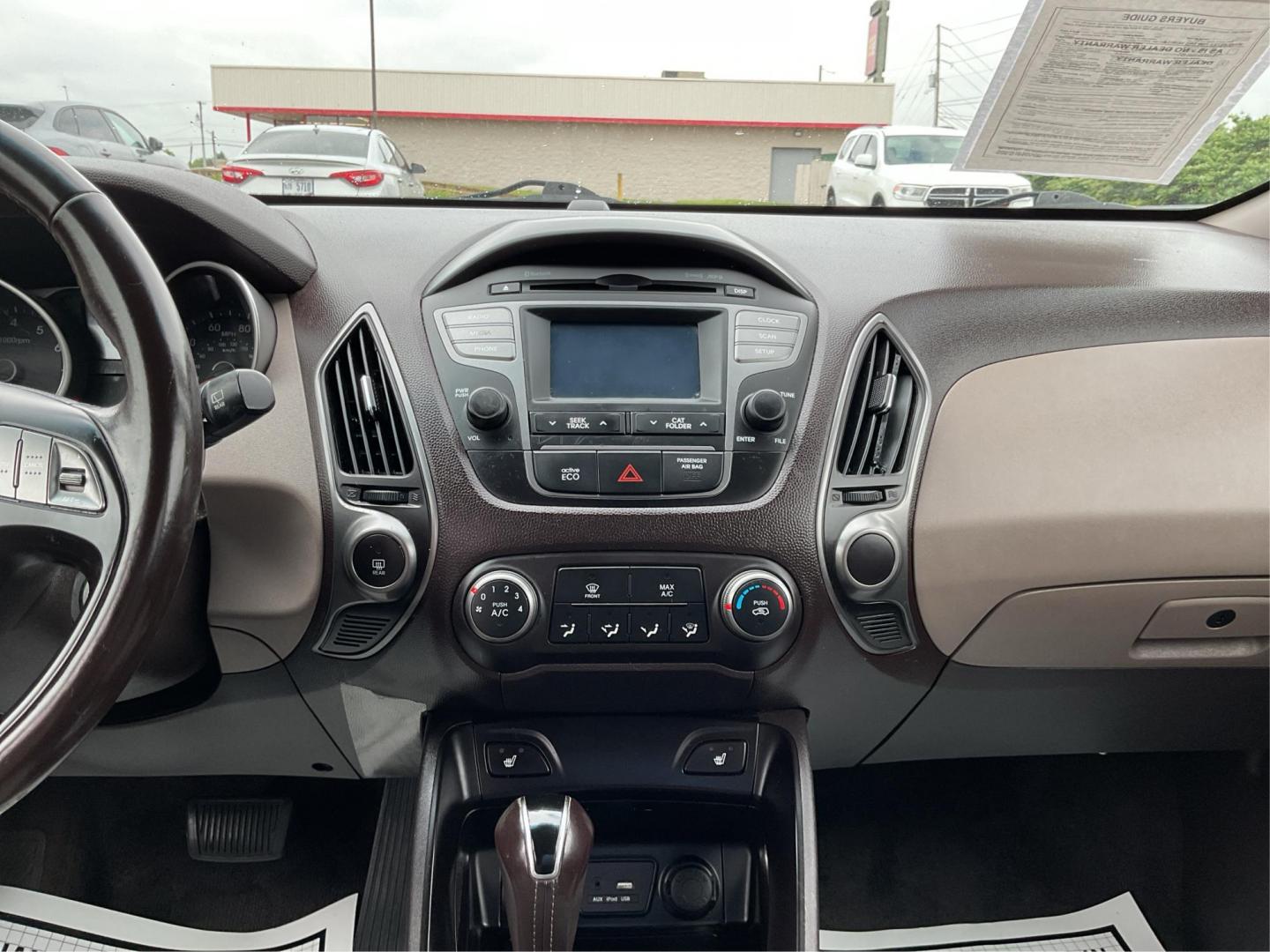 2015 Hyundai Tucson SE (KM8JUCAG2FU) with an Theta II 2.4L I-4 gasoline direct injection engine, located at 880 E. National Road, Vandalia, OH, 45377, (937) 908-9800, 39.891918, -84.183594 - 2015 Hyundai Tucson SE - Photo#13