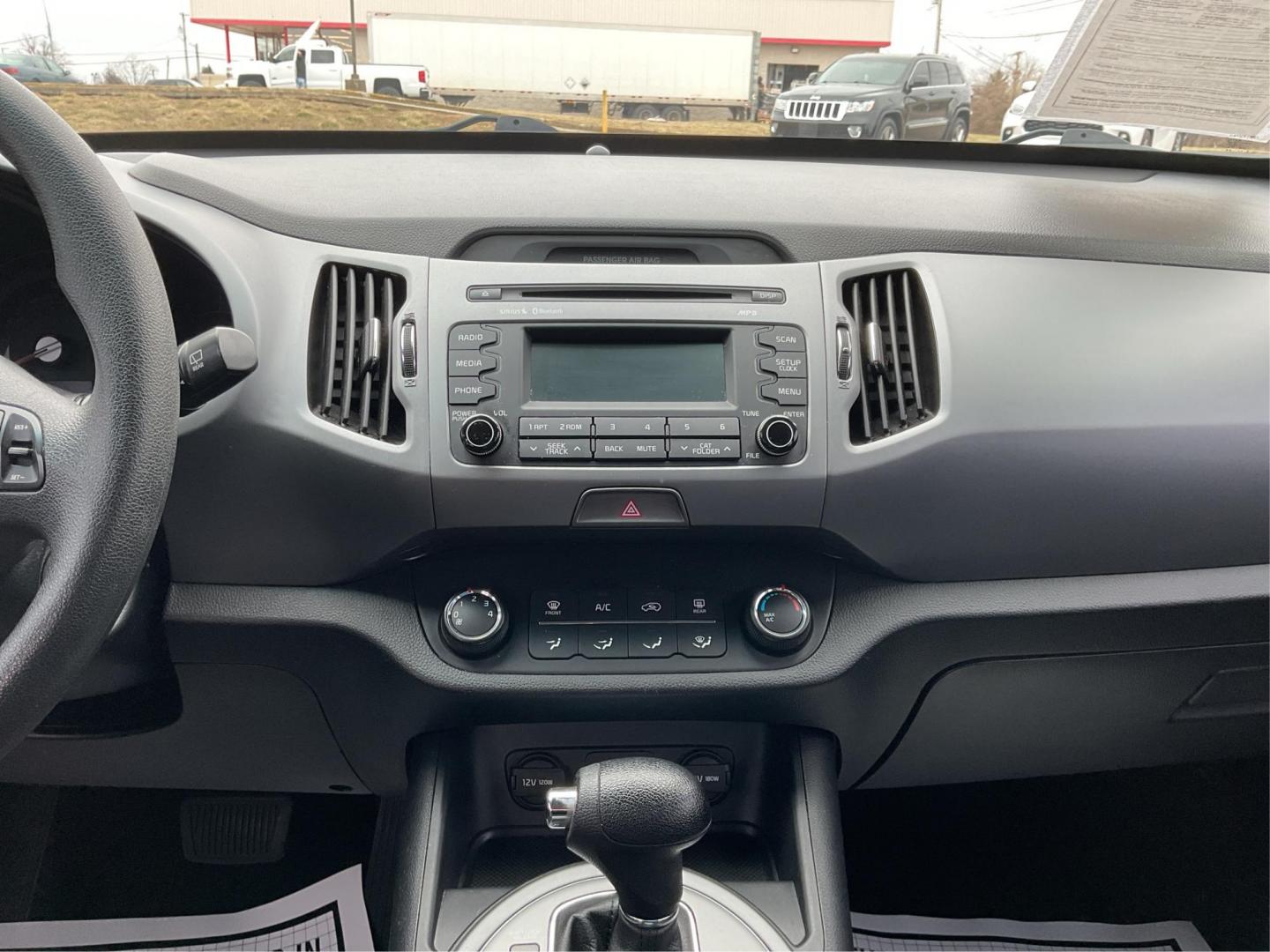 2015 Kia Sportage LX FWD (KNDPB3AC3F7) with an 2.4L V6 DOHC 24V engine, 6-Speed Automatic transmission, located at 1099 N County Rd 25A, Troy, OH, 45373, (937) 908-9800, 40.057079, -84.212883 - 2015 Kia Sportage LX FWD - Photo#12