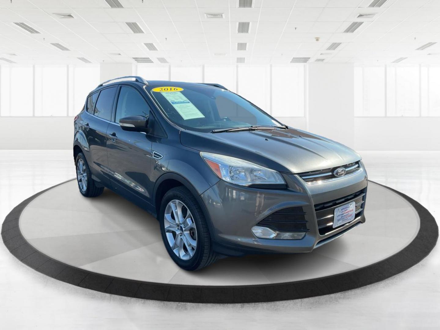 2016 Ford Escape Titanium (1FMCU9J92GU) with an EcoBoost 1.6L I-4 gasoline direct injection engine, located at 1184 Kauffman Ave, Fairborn, OH, 45324, (937) 908-9800, 39.807072, -84.030914 - 2016 Ford Escape Titanium - Photo#0