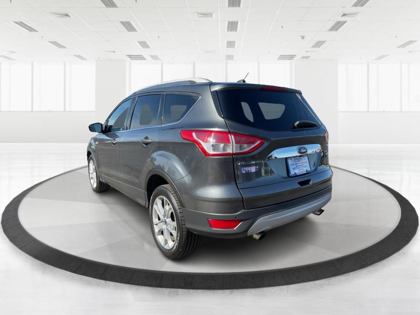2016 Ford Escape Titanium (1FMCU9J92GU) with an EcoBoost 1.6L I-4 gasoline direct injection engine, located at 1184 Kauffman Ave, Fairborn, OH, 45324, (937) 908-9800, 39.807072, -84.030914 - 2016 Ford Escape Titanium - Photo#4