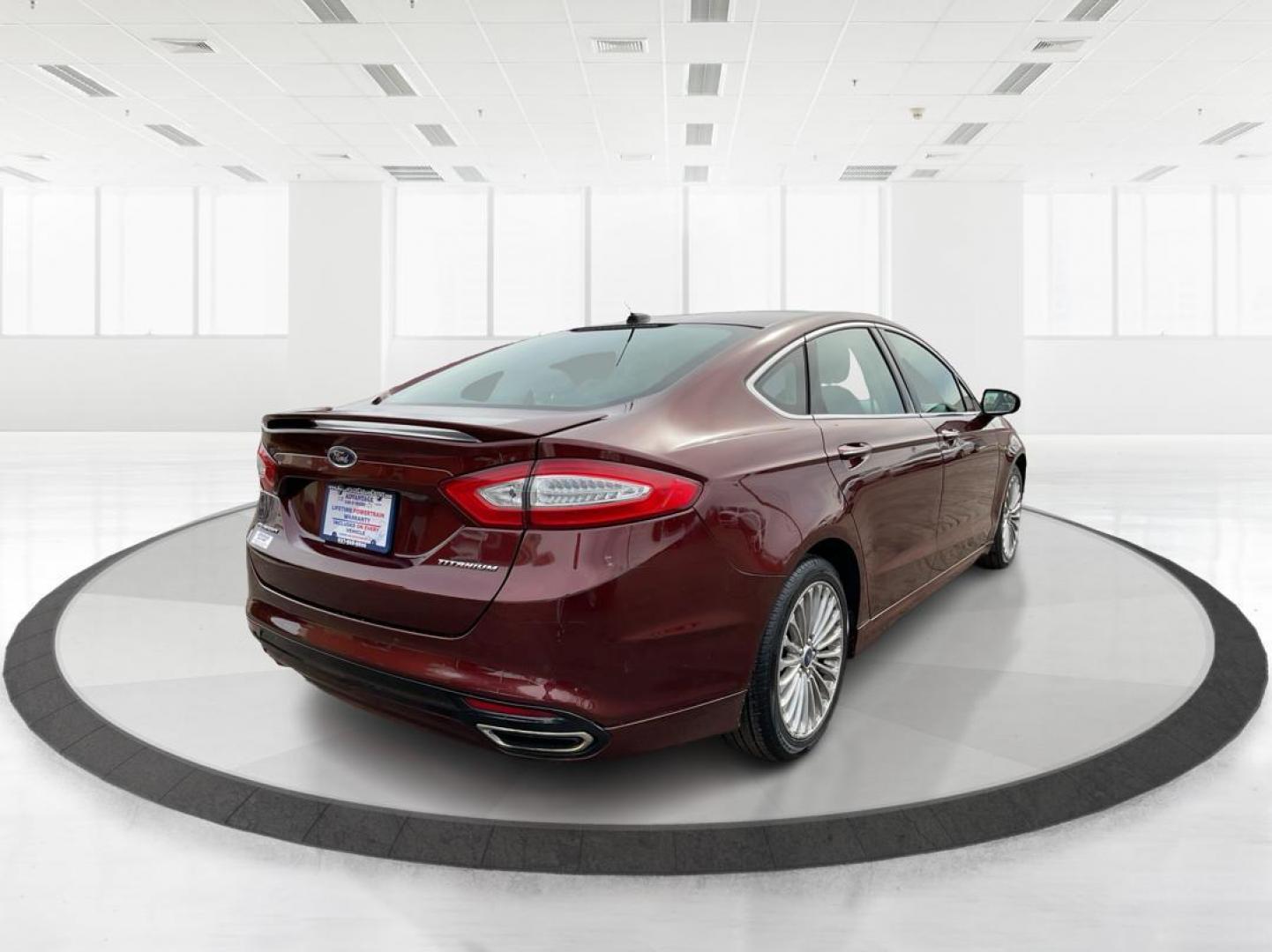 2016 Ford Fusion Titanium (3FA6P0K92GR) with an EcoBoost 2L I-4 gasoline direct injection engine, located at 4508 South Dixie Dr, Moraine, OH, 45439, (937) 908-9800, 39.689976, -84.218452 - 2016 Ford Fusion Titanium - Photo#2