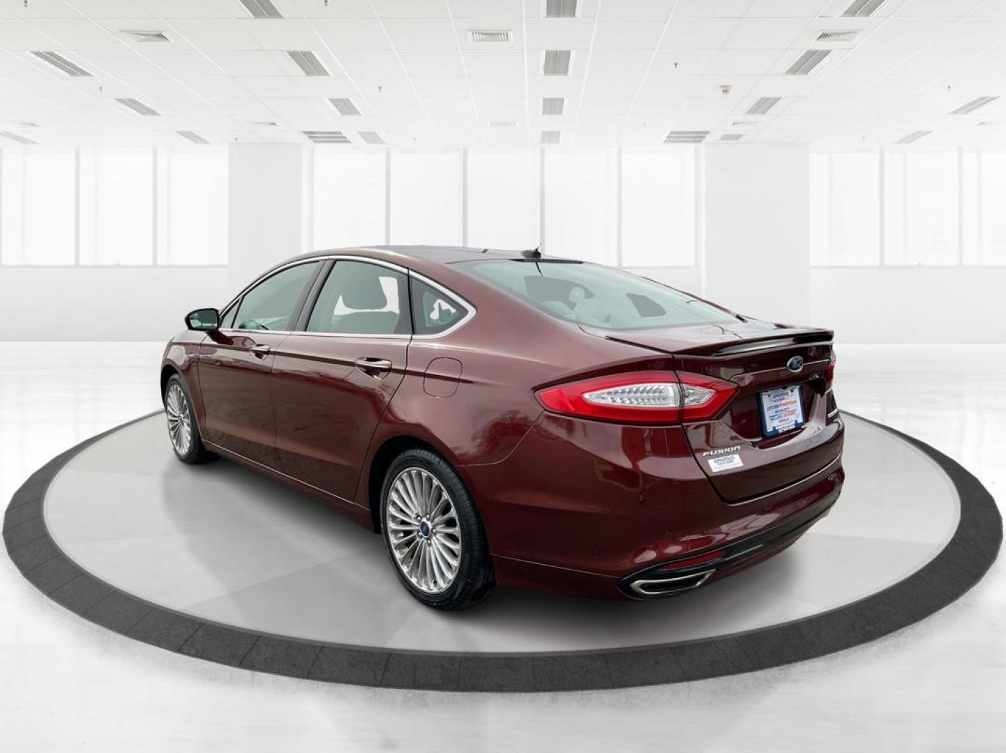 2016 Ford Fusion Titanium (3FA6P0K92GR) with an EcoBoost 2L I-4 gasoline direct injection engine, located at 4508 South Dixie Dr, Moraine, OH, 45439, (937) 908-9800, 39.689976, -84.218452 - 2016 Ford Fusion Titanium - Photo#4