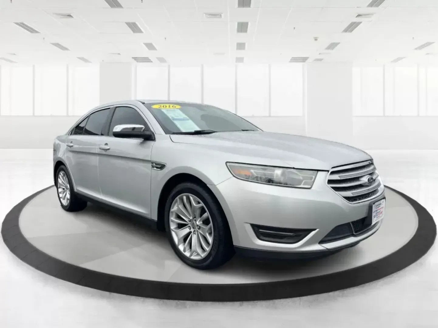 2016 Ford Taurus Limited (1FAHP2F82GG) with an EcoBoost 2L I-4 gasoline direct injection engine, located at 8750 N County Rd 25A, Piqua, OH, 45356, (937) 908-9800, 40.164391, -84.232513 - **Experience the Ultimate in Comfort and Style with the 2016 Ford Taurus Limited at Advantage Car and Credit!**<br /> <br /> Are you searching for a reliable sedan that seamlessly fits into your busy lifestyle? Whether you're commuting to work, taking the kids to soccer practice, or planning a weeke - Photo#0