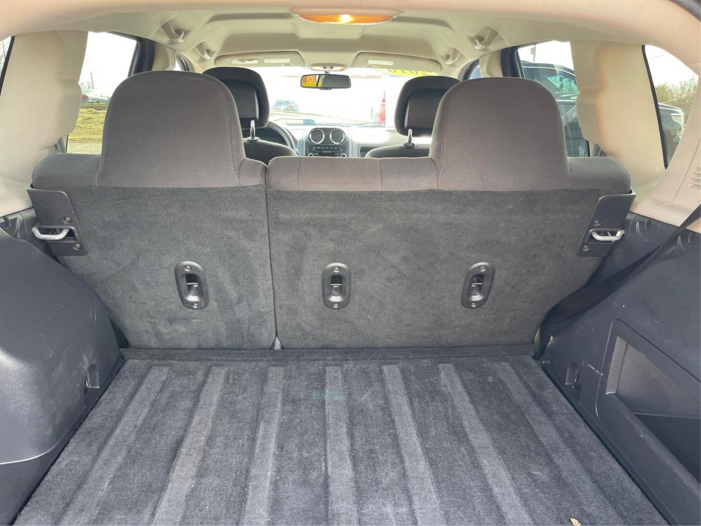 2016 Blue Jeep Compass Sport 4WD (1C4NJDBB5GD) with an 2.4L L4 DOHC 16V engine, located at 8750 N County Rd 25A, Piqua, OH, 45356, (937) 908-9800, 40.164391, -84.232513 - 2016 Jeep Compass Sport 4WD - Photo#11