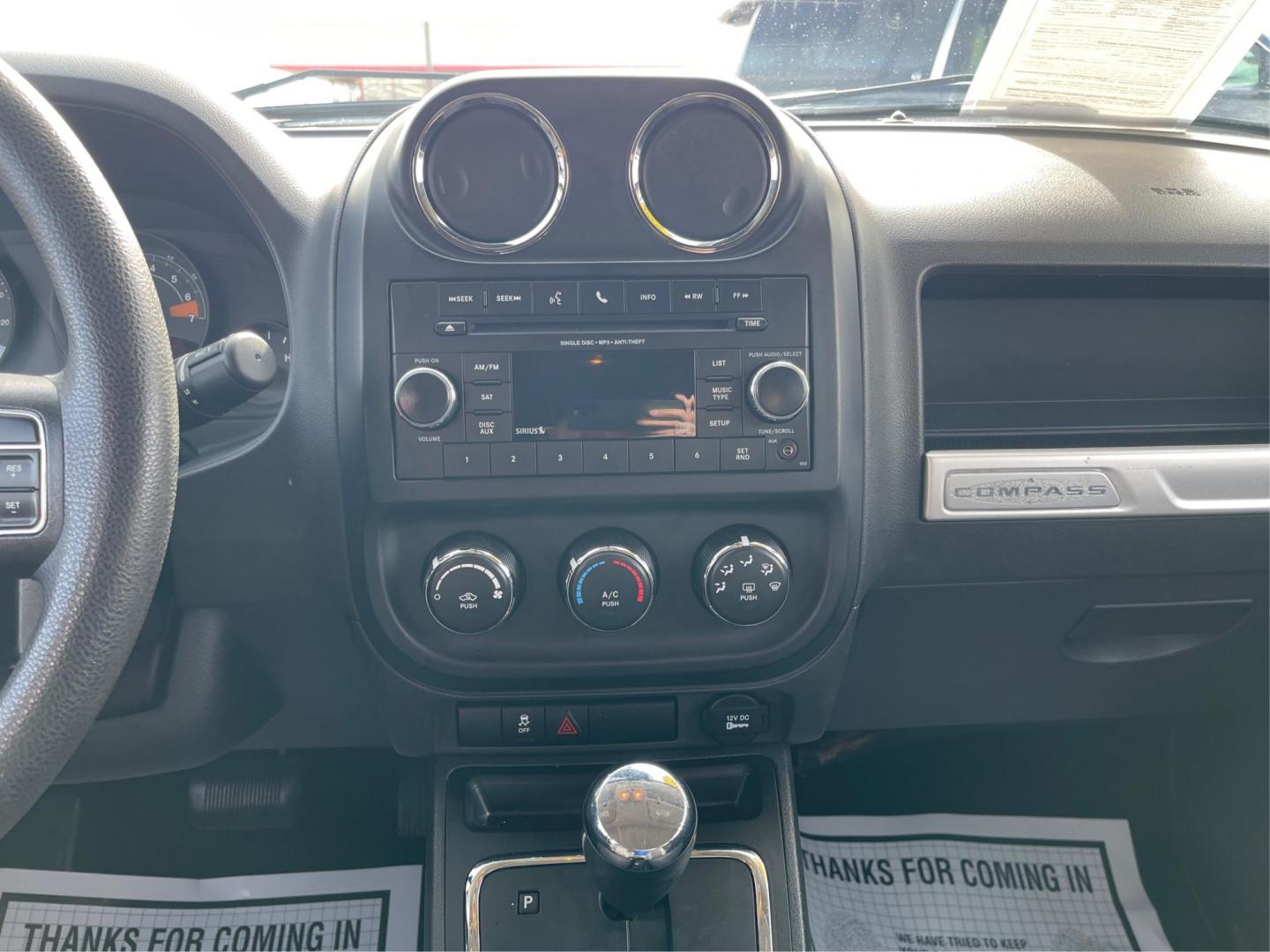 2016 Blue Jeep Compass Sport 4WD (1C4NJDBB5GD) with an 2.4L L4 DOHC 16V engine, located at 8750 N County Rd 25A, Piqua, OH, 45356, (937) 908-9800, 40.164391, -84.232513 - 2016 Jeep Compass Sport 4WD - Photo#12