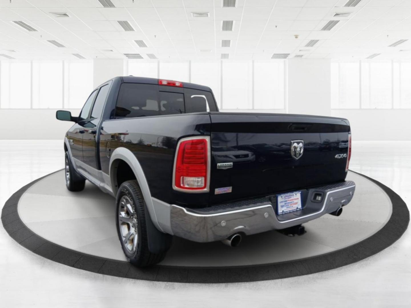 2017 Ram 1500 Laramie Quad Cab 4WD (1C6RR7JT1HS) with an 5.7L V8 OHV 16V engine, 8-Speed Automatic transmission, located at 1184 Kauffman Ave, Fairborn, OH, 45324, (937) 908-9800, 39.807072, -84.030914 - 2017 Ram 1500 Laramie Quad Cab 4WD - Photo#4