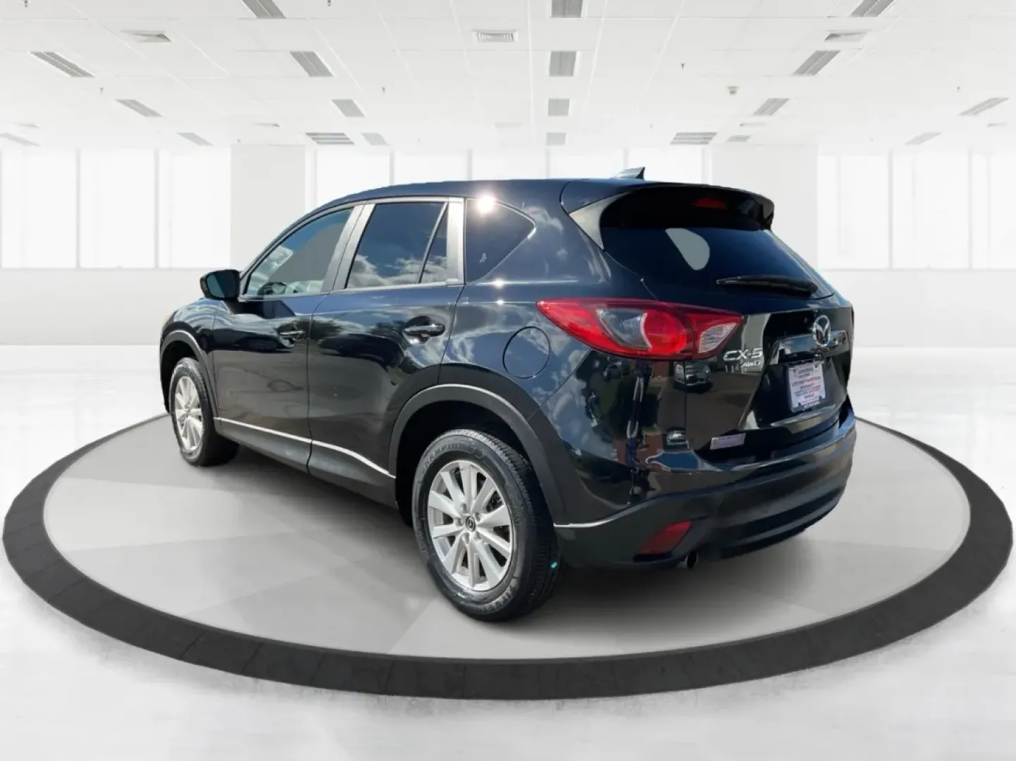 2014 Jet Black Mica Mazda CX-5 Touring AWD (JM3KE4CY2E0) with an 2.5L L4 DOHC 16V engine, 6-Speed Automatic transmission, located at 1099 N County Rd 25A, Troy, OH, 45373, (937) 908-9800, 40.057079, -84.212883 - **Explore the Open Road in the 2014 Mazda CX-5 Touring AWD from Advantage Car and Credit - Troy!**<br /> <br /> Are you ready to elevate your driving experience? Whether you're a growing family seeking a reliable SUV for weekend adventures, a commuter looking for comfort on long drives, or a budget- - Photo#4