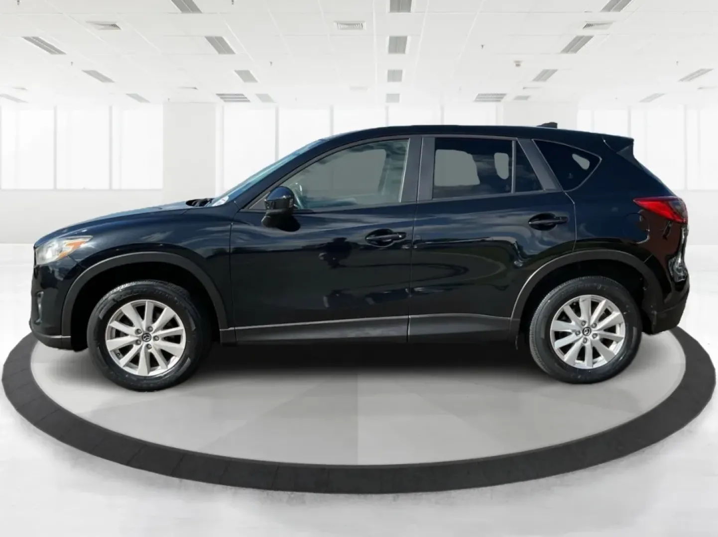 2014 Jet Black Mica Mazda CX-5 Touring AWD (JM3KE4CY2E0) with an 2.5L L4 DOHC 16V engine, 6-Speed Automatic transmission, located at 1099 N County Rd 25A, Troy, OH, 45373, (937) 908-9800, 40.057079, -84.212883 - **Explore the Open Road in the 2014 Mazda CX-5 Touring AWD from Advantage Car and Credit - Troy!**<br /> <br /> Are you ready to elevate your driving experience? Whether you're a growing family seeking a reliable SUV for weekend adventures, a commuter looking for comfort on long drives, or a budget- - Photo#5