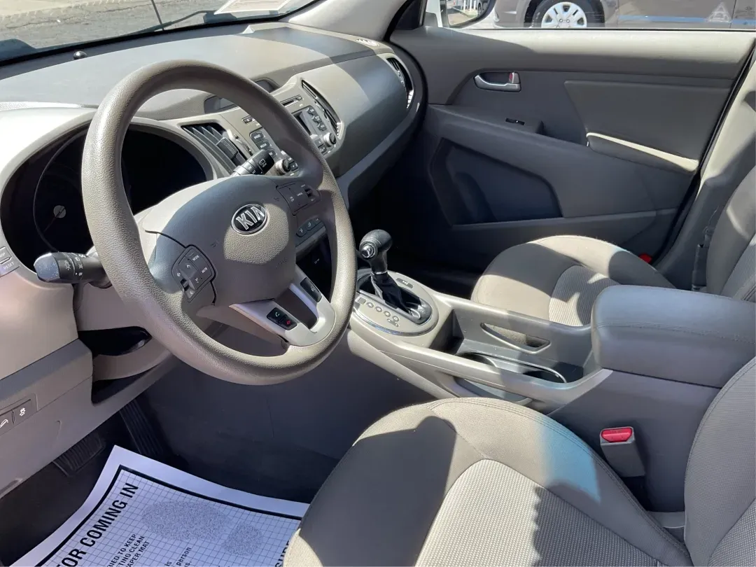 2015 Kia Sportage LX (KNDPBCAC7F7) with an Other engine, located at 880 E. National Road, Vandalia, OH, 45377, (937) 908-9800, 39.891918, -84.183594 - **Explore the Open Road with the 2015 Kia Sportage LX Perfect for Your Next Adventure!**<br /> <br /> Imagine hitting the open road with your loved ones, whether it's a weekend getaway or a daily commute. The 2015 Kia Sportage LX, available at Advantage Car and Credit in Fairborn, OH, is the ideal - Photo#9