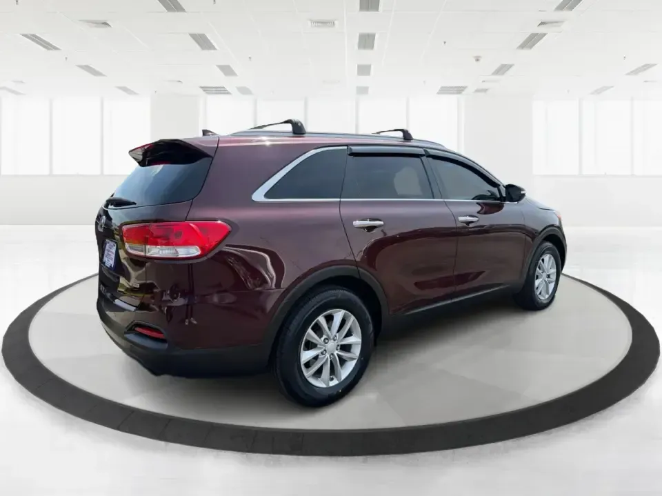 2017 Burgundy Kia Sorento L 2WD (5XYPG4A31HG) with an 2.4L L4 DOHC 16V engine, 6-Speed Automatic transmission, located at 4508 South Dixie Dr, Moraine, OH, 45439, (937) 908-9800, 39.689976, -84.218452 - Pack up the kids, load the groceries, and still have room for a spontaneous weekend escape to Carillon Historical Park or a day exploring Cox Arboretum-this 2017 Kia Sorento L 2WD is the kind of practical SUV that fits real Moraine and Dayton-area life. With three-row versatility in a midsize footpr - Photo#2