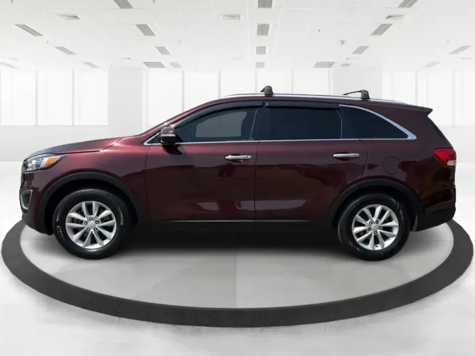2017 Burgundy Kia Sorento L 2WD (5XYPG4A31HG) with an 2.4L L4 DOHC 16V engine, 6-Speed Automatic transmission, located at 4508 South Dixie Dr, Moraine, OH, 45439, (937) 908-9800, 39.689976, -84.218452 - Pack up the kids, load the groceries, and still have room for a spontaneous weekend escape to Carillon Historical Park or a day exploring Cox Arboretum-this 2017 Kia Sorento L 2WD is the kind of practical SUV that fits real Moraine and Dayton-area life. With three-row versatility in a midsize footpr - Photo#5