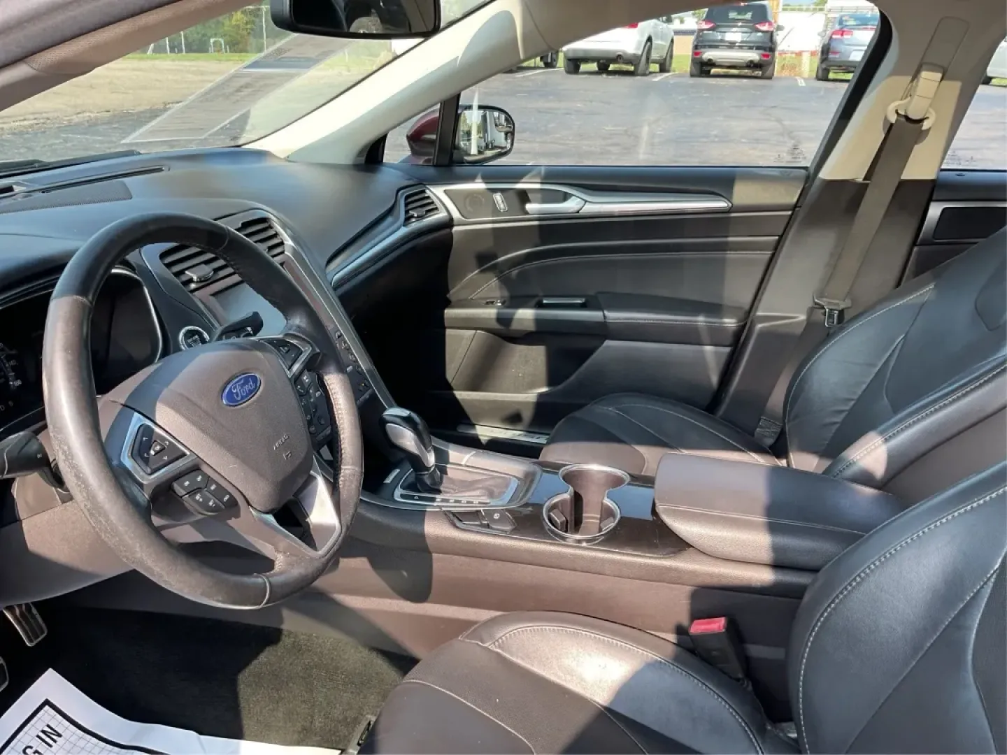 2016 Ford Fusion Titanium (3FA6P0K92GR) with an EcoBoost 2L I-4 gasoline direct injection engine, located at 1099 N County Rd 25A, Troy, OH, 45373, (937) 908-9800, 40.057079, -84.212883 - **Elevate Your Driving Experience with the 2016 Ford Fusion Titanium Where Style Meets Functionality!**<br /> <br /> Are you searching for the perfect blend of style, comfort, and advanced technology for your daily commute or weekend getaways? Look no further than the stunning 2016 Ford Fusion Tita - Photo#9