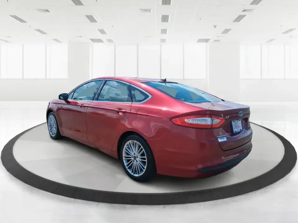 2016 Ford Fusion SE (3FA6P0HD7GR) with an 1.5L L4 DOHC 16V engine, 6-Speed Automatic transmission, located at 1099 N County Rd 25A, Troy, OH, 45373, (937) 908-9800, 40.057079, -84.212883 - Experience the perfect blend of style, comfort, and reliability with this 2016 Ford Fusion SE, available now at Advantage Car and Credit in Fairborn, OH. Whether you're a commuter navigating the busy streets of downtown Fairborn or a growing family looking for a dependable vehicle for your weekend a - Photo#4