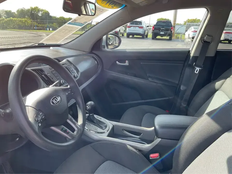 2015 Kia Sportage LX (KNDPBCAC2F7) with an 2.4L V6 DOHC 24V engine, 6-Speed Automatic transmission, located at 1099 N County Rd 25A, Troy, OH, 45373, (937) 908-9800, 40.057079, -84.212883 - Are you ready to elevate your driving experience and embark on unforgettable adventures? Look no further than this 2015 Kia Sportage LX, perfect for those who crave a reliable crossover that blends style with versatility. Whether you're commuting to work, shuttling the kids to school, or planning a - Photo#9