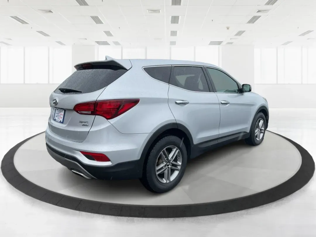 2017 Hyundai Santa Fe 2.4L (5XYZTDLB2HG) with an Theta II 2.4L I-4 gasoline direct injection engine, 6A transmission, located at 1951 S Dayton Lakeview Rd., New Carlisle, OH, 45344, (937) 908-9800, 39.890999, -84.050255 - Discover the perfect blend of comfort, capability, and style with the 2017 Hyundai Santa Fe, now available at Advantage Car and Credit, located at 1184 Kauffman Ave, Fairborn, OH 45324. This versatile SUV is an excellent choice for growing families, weekend adventurers, or budget-conscious buyers lo - Photo#2