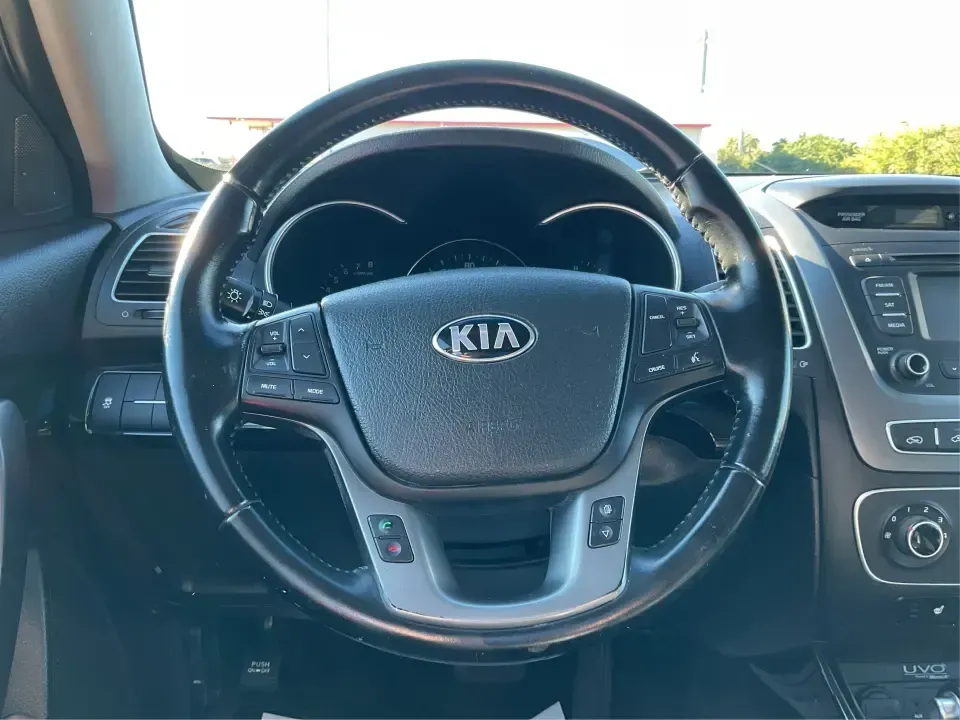 2015 Kia Sorento LX (5XYKTCA66FG) with an 2.4L I-4 gasoline direct injection engine, 6-Speed Automatic transmission, located at 8750 N County Rd 25A, Piqua, OH, 45356, (937) 908-9800, 40.164391, -84.232513 - **Adventure Awaits with the 2015 Kia Sorento LX from Advantage Car and Credit!**<br /> <br /> Are you ready to elevate your family outings or embark on unforgettable weekend adventures? Look no further than this stunning **2015 Kia Sorento LX**! With its striking Remington Red Metallic exterior and - Photo#16