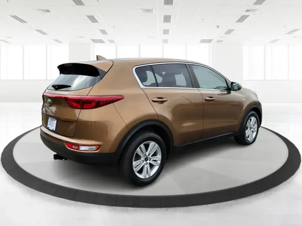 2017 Kia Sportage LX AWD (KNDPMCAC2H7) with an 2.4L V6 DOHC 24V engine, 6A transmission, located at 8750 N County Rd 25A, Piqua, OH, 45356, (937) 908-9800, 40.164391, -84.232513 - Picture a weekend that starts with soccer drop-off in Piqua, turns into a quick Costco run, and still leaves room for a sunset drive toward the Miami Valley-this 2017 Kia Sportage LX AWD is the kind of crossover that fits real-life schedules. With seating for five, confident all-wheel drive, and a v- Photo#2