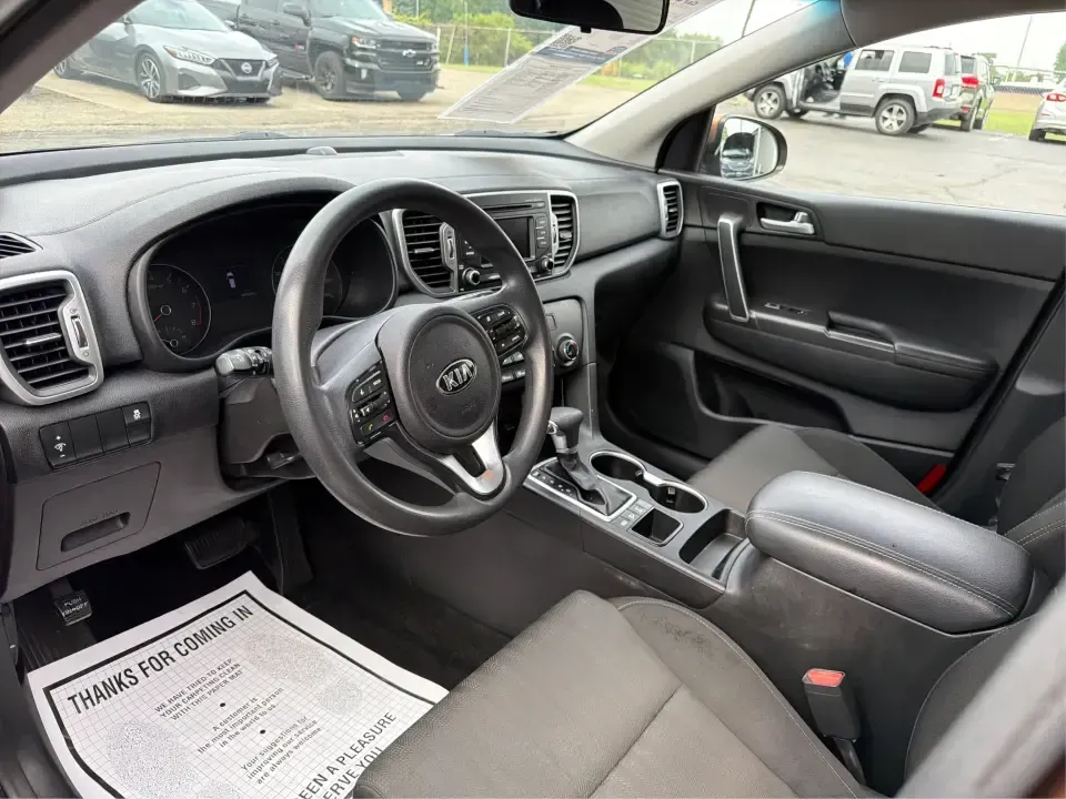 2017 Kia Sportage LX AWD (KNDPMCAC2H7) with an 2.4L V6 DOHC 24V engine, 6A transmission, located at 8750 N County Rd 25A, Piqua, OH, 45356, (937) 908-9800, 40.164391, -84.232513 - Picture a weekend that starts with soccer drop-off in Piqua, turns into a quick Costco run, and still leaves room for a sunset drive toward the Miami Valley-this 2017 Kia Sportage LX AWD is the kind of crossover that fits real-life schedules. With seating for five, confident all-wheel drive, and a v- Photo#9
