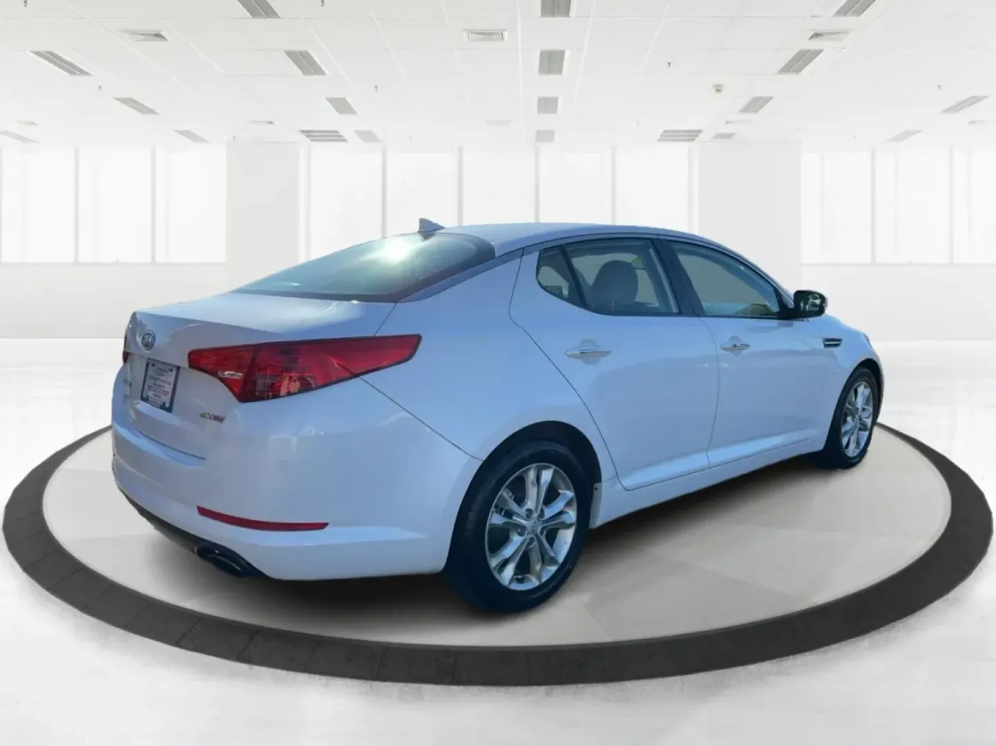 2012 Kia Optima EX (5XXGN4A70CG) with an 2.4L I-4 gasoline direct injection engine, located at 1951 S Dayton Lakeview Rd., New Carlisle, OH, 45344, (937) 908-9800, 39.890999, -84.050255 - Elevate your driving experience with this stunning 2012 Kia Optima EX, a perfect blend of style, comfort, and reliability. Ideal for budget-conscious buyers and growing families alike, this sedan is designed to meet your daily commuting needs while offering the space and features essential for both - Photo#2