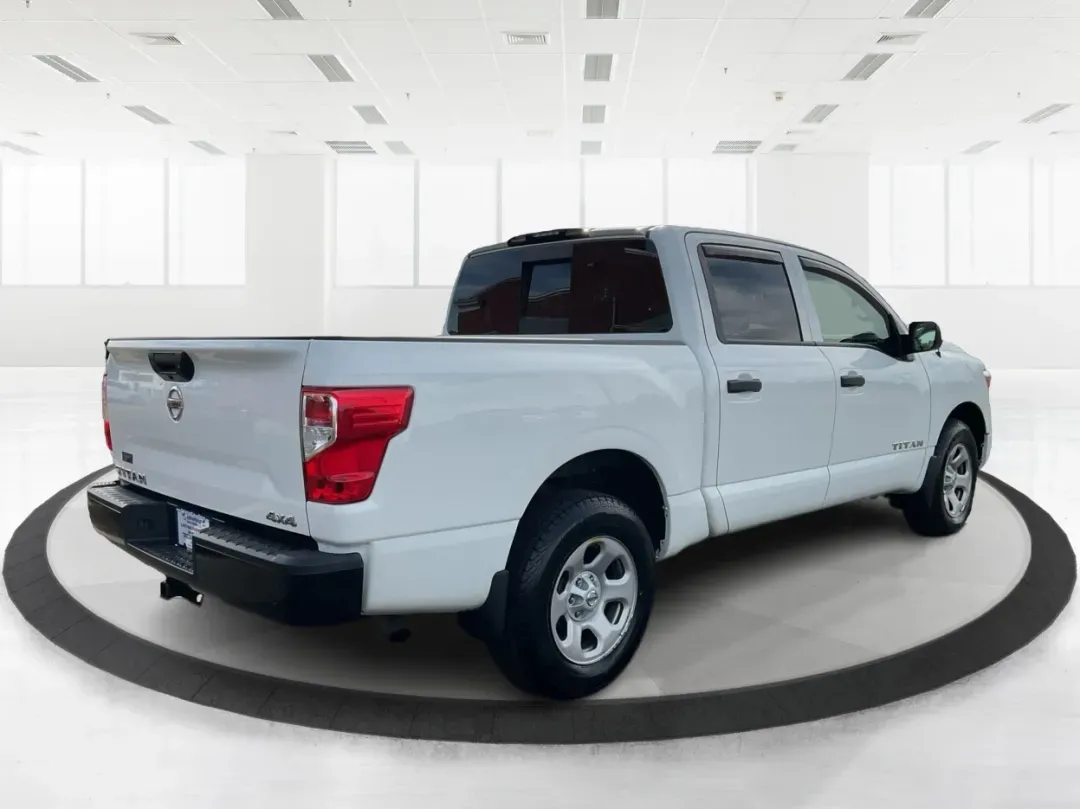2021 Nissan TITAN Crew Cab S 4x4 (1N6AA1EC4MN) with an Endurance 5.6L V-8 gasoline direct injection engine, located at 1099 N County Rd 25A, Troy, OH, 45373, (937) 908-9800, 40.057079, -84.212883 - Discover ultimate versatility and rugged capability with this 2021 Nissan TITAN Crew Cab S 4x4, now available at Advantage Car and Credit in Piqua, OH. Whether you're navigating the bustling streets of Piqua or heading out for weekend adventures, this truck is designed to adapt to your lifestyle. Pe - Photo#2