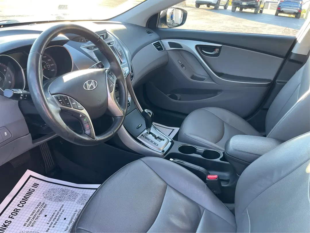 2013 Hyundai Elantra Limited (5NPDH4AE8DH) with an 1.8L I-4 DOHC engine, located at 1099 N County Rd 25A, Troy, OH, 45373, (937) 908-9800, 40.057079, -84.212883 - Elevate your daily commute and family adventures with the versatile and stylish 2013 Hyundai Elantra Limited, available now at Advantage Car and Credit - Troy. This exceptional sedan is designed for those who appreciate a blend of comfort, efficiency, and advanced technology, making it an ideal choi - Photo#9