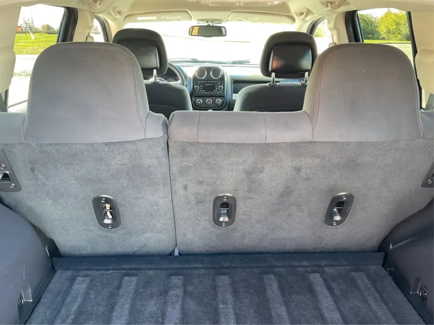 2014 Jeep Compass Sport (1C4NJDBB8ED) with an 2.4L I-4 DOHC engine, located at 1099 N County Rd 25A, Troy, OH, 45373, (937) 908-9800, 40.057079, -84.212883 - Discover the adventure-ready 2014 Jeep Compass, an SUV that's perfect for weekend getaways and daily commutes alike. Whether you're navigating the bustling streets of Troy or heading out on a family road trip to nearby attractions like the Miami County Fair, this rugged vehicle will elevate your dri - Photo#12