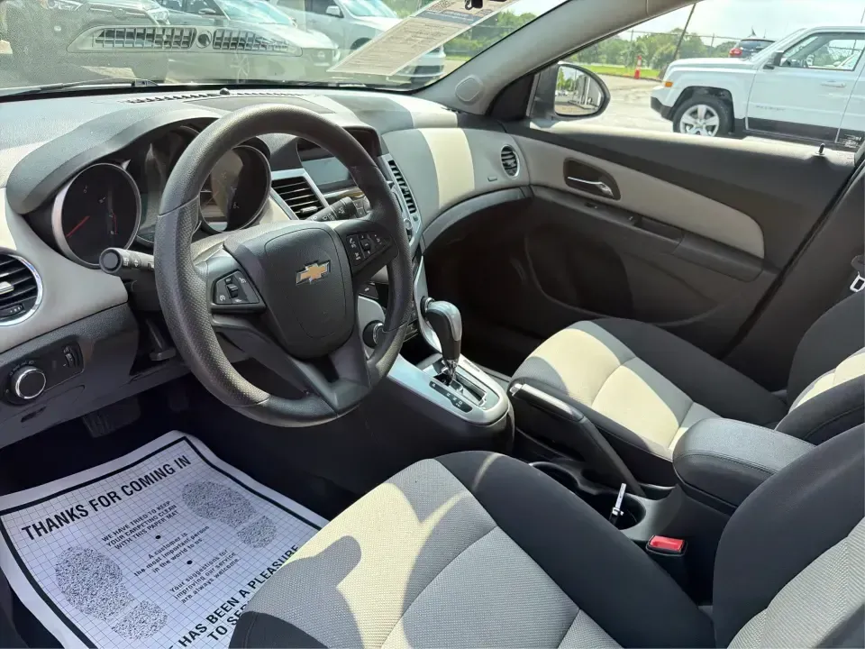 2015 Chevrolet Cruze LS Auto (1G1PA5SH8F7) with an 1.8L L4 DOHC 16V FFV engine, 6-Speed Automatic transmission, located at 1099 N County Rd 25A, Troy, OH, 45373, (937) 908-9800, 40.057079, -84.212883 - Need a smart, budget-friendly commuter that can handle the daily drive from Troy to Dayton, school drop-offs, and the occasional weekend run to The Greene or a day at Troy's Strawberry Festival? This 2015 Chevrolet Cruze LS Auto is built for real life-easy to park downtown near the Square, efficient- Photo#9