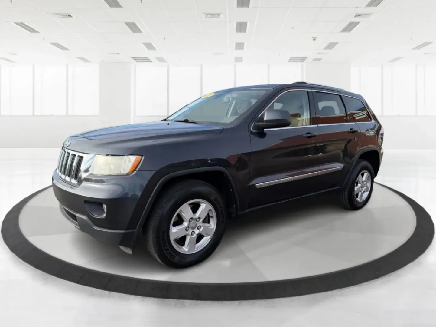 2012 Jeep Grand Cherokee Laredo (1C4RJFAG0CC) with an Other engine, located at 1099 N County Rd 25A, Troy, OH, 45373, (937) 908-9800, 40.057079, -84.212883 - **Adventure Awaits: Explore the Open Road in a 2012 Jeep Grand Cherokee Laredo!**<br /> <br /> If you're a weekend warrior or a growing family looking for your next adventure, this 2012 Jeep Grand Cherokee Laredo is the perfect fit for you! With its robust 4WD capabilities and spacious interior, you - Photo#8