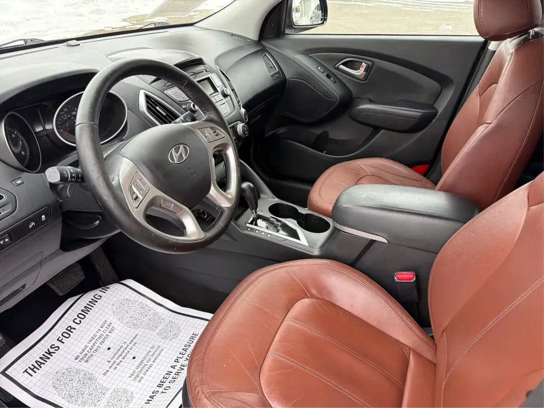 2012 Hyundai Tucson Limited (KM8JU3AC5CU) with an Theta II 2.4L I-4 DOHC engine, located at 880 E. National Road, Vandalia, OH, 45377, (937) 908-9800, 39.891918, -84.183594 - Need a dependable SUV that fits real life-school drop-offs, I-75 commuting, and weekend getaways to Taylorsville MetroPark-without the stress of traditional bank rules? This 2012 Hyundai Tucson Limited in Ash Black is a smart, comfortable choice for Vandalia drivers who want a practical daily vehicl - Photo#9